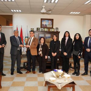 Assistant Secretary-General of the association of Arab universities award a participation trophy to the president of Cihan University-Erbil
